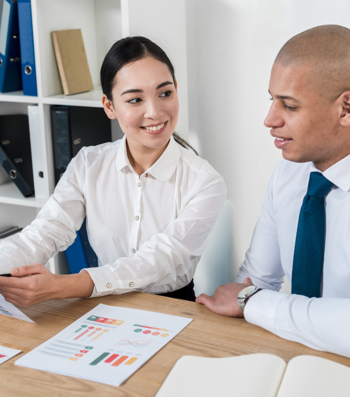 young-asian-businesswoman-showing-business-report-her-colleague